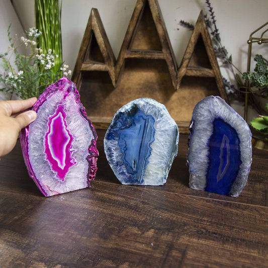 Vibrant Agate Geode Cut Base Crystal Lamp showcasing pink and blue hues, perfect for illuminating your space.