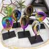 Rainbow Titanium Aura Geode Crystal on Stand showcases vibrant hues, perfect for inspiring positivity in any space.