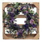 Lively Pasadena Wreath featuring baby eucalyptus and dried flowers, elegantly displayed in a wooden crate.