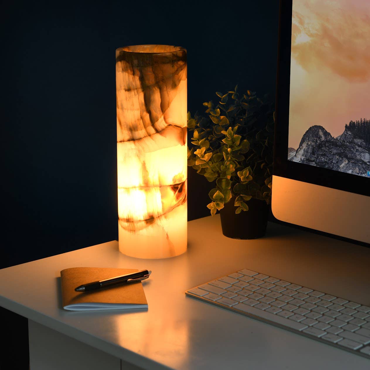 Elegant Handcrafted Onyx Table Lamp - Cylinder emits a warm amber glow, enhancing any workspace with its natural beauty.