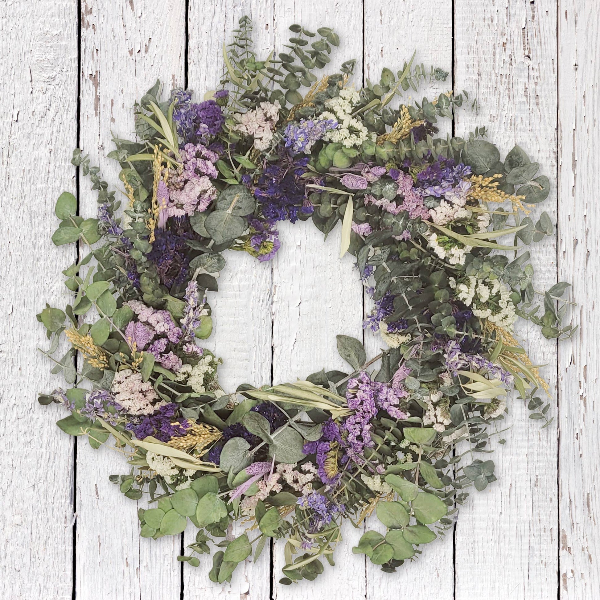 Lively Pasadena Wreath made of baby eucalyptus and dried flowers, perfect for adding elegance to any space.