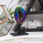 Rainbow Titanium Aura Geode Crystal on Stand showcases vibrant hues, perfect for uplifting any space.