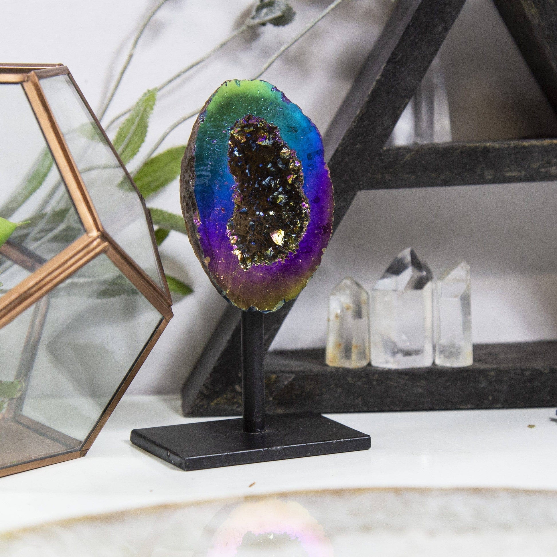 Rainbow Titanium Aura Geode Crystal on Stand showcases vibrant hues, perfect for uplifting any space.