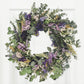 Lively Pasadena Wreath crafted with eucalyptus and dried flowers, adding elegance to any space. Perfectly charming décor.