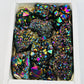 Colorful Amethyst Rainbow Titanium Crystals in a box, showcasing their stunning vibrancy and natural elegance.