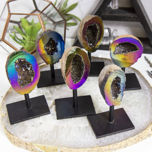 Rainbow Titanium Aura Geode Crystal on Stand showcases vibrant hues, perfect for inspiring positivity in any space.