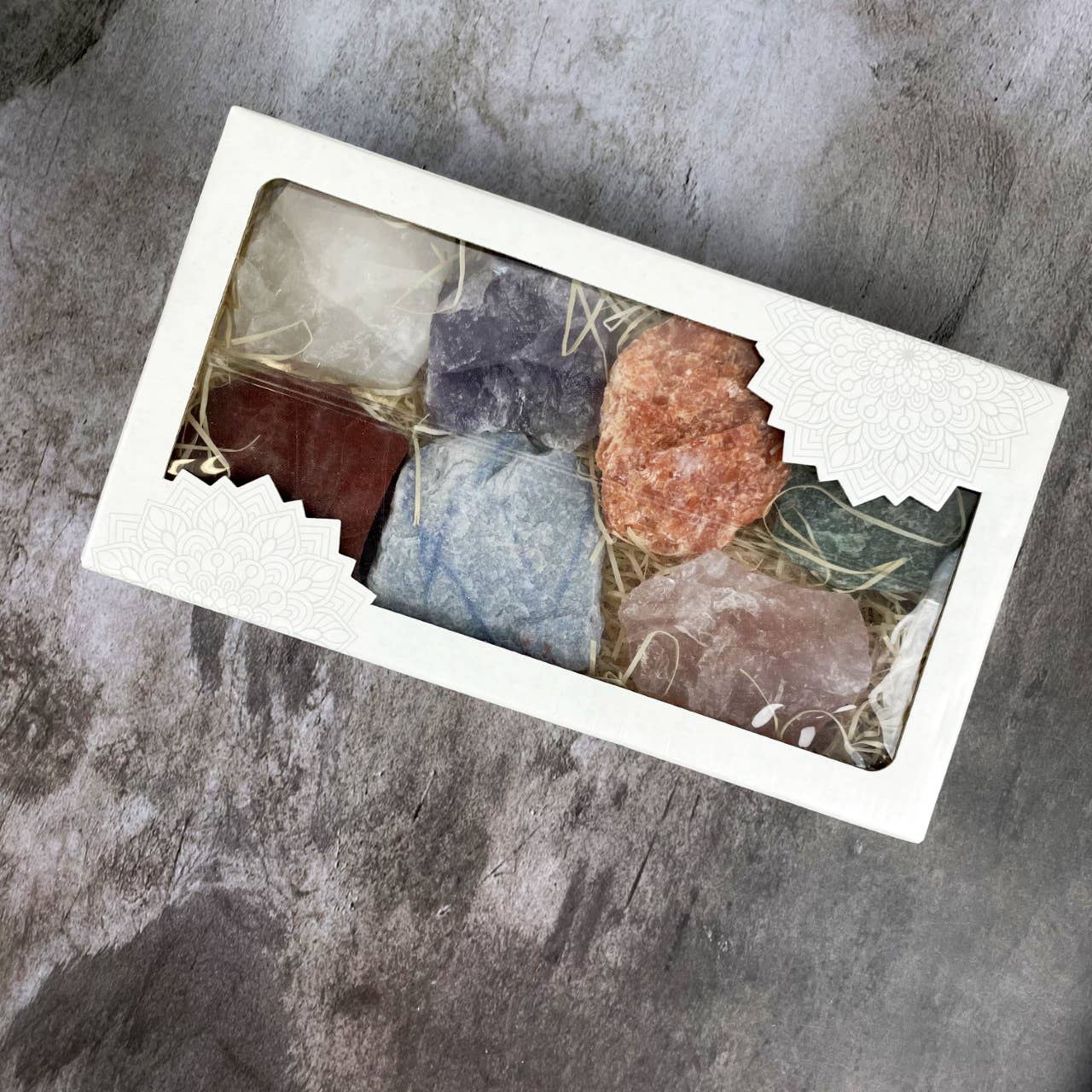 Explore the Chakra Rough Stone Crystal Set of 7 - Boxed Collection, perfect for energy transformation and chakra balance.