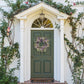 Elegant Pasadena Wreath made of baby eucalyptus and dried flowers, perfect for enhancing any entryway.