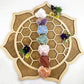 Chakra Rough Stone Crystal Set of 7 - Boxed Collection displayed on a wooden mandala, perfect for energy healing.