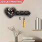 Decorative wall hooks with heart design and 'Home Sweet Home' text, featuring a yellow umbrella and books on a shelf.
