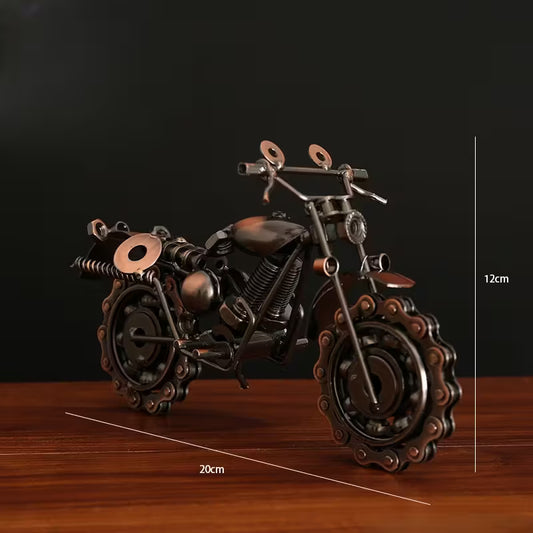 Metallic motorcycle model on a wooden surface with measurement indicators.